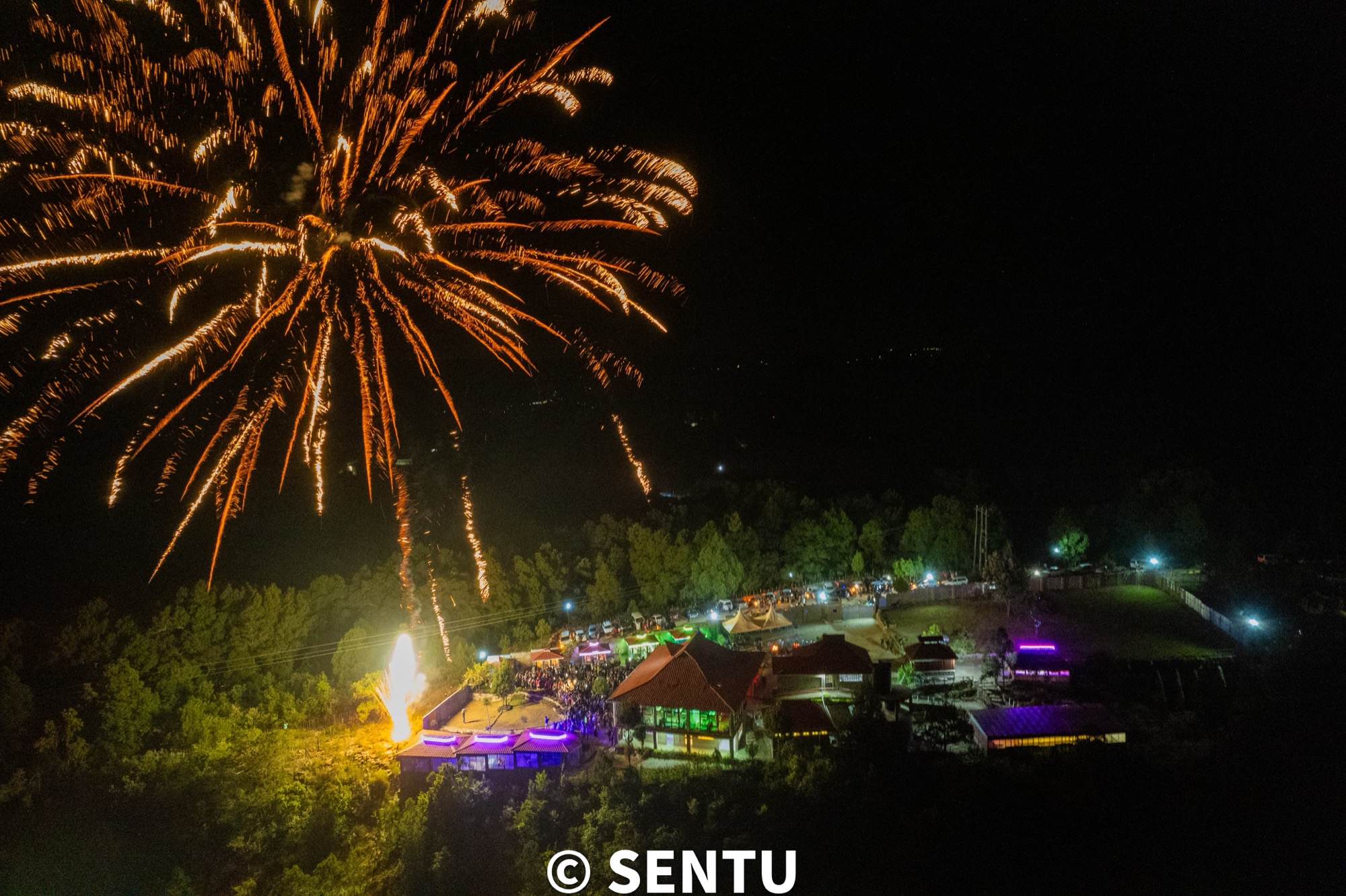 Fireworks lighting up the night sky above Sentu Resort during a special event
