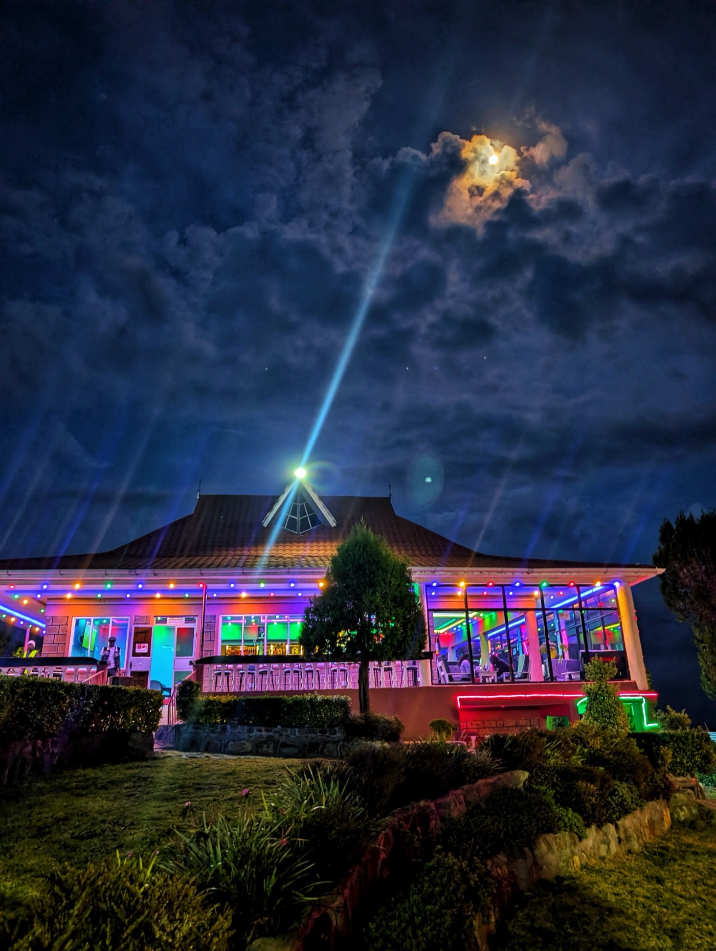 Full moon rising over Sentu Resort on a starlit evening